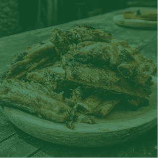 Char-grilled ribs on a rustic plate
