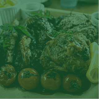 Slow-cooked meat platter with olives and lemon