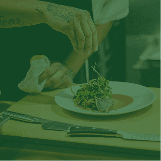 Chef plating a signature dish